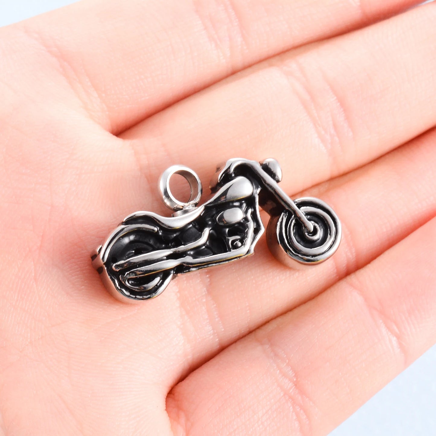 Motorcycle charm held in a hand