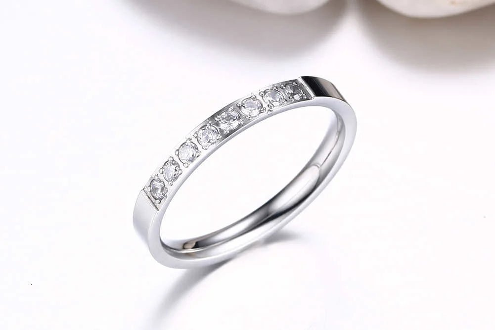 ladies stainless steel and zirconias wedding band