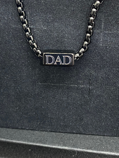 black bracelet engraved with DAD 