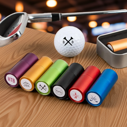 Set of colorful golf ball markers with a golf club and ball on a wooden surface.