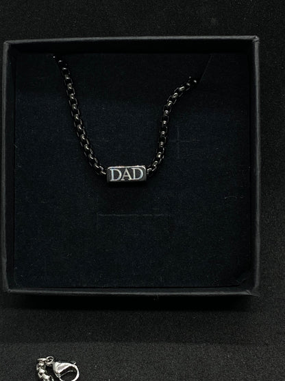 Bracelet with 'DAD' on a black box