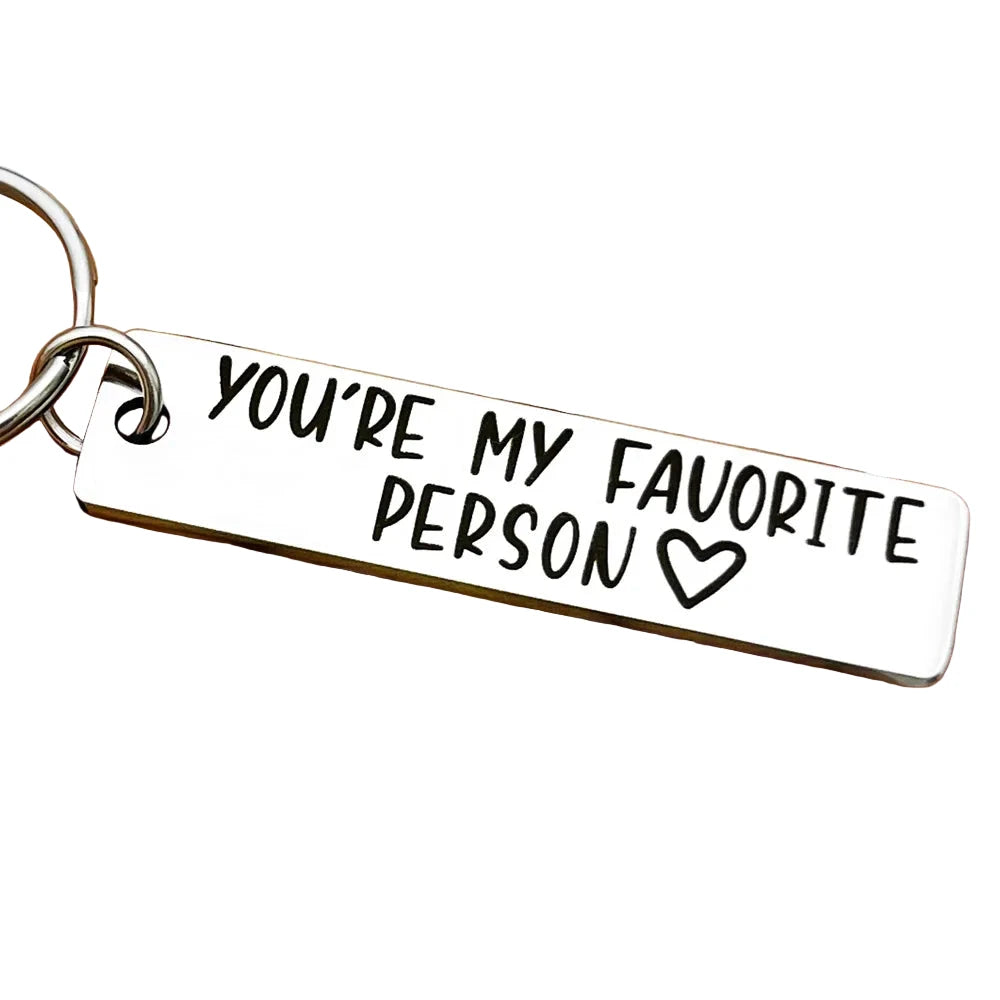 Keychain with 'You're my favorite person' text held in a hand