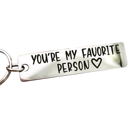 Silver keychain with 'You're My Favorite Person' text on a white background