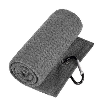 Rolled-up gray towel with a carabiner clip on a white background