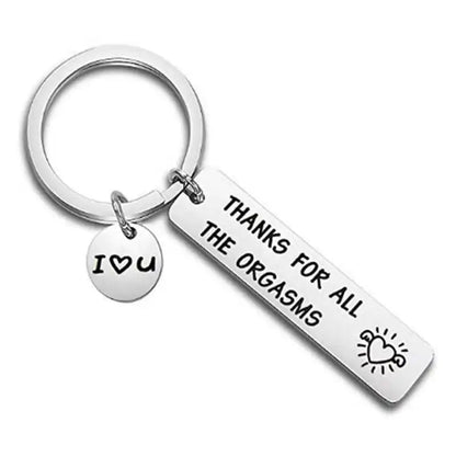 Keychain with 'Thanks for all the orgasms' and 'I ❤️ U' tags on a white background