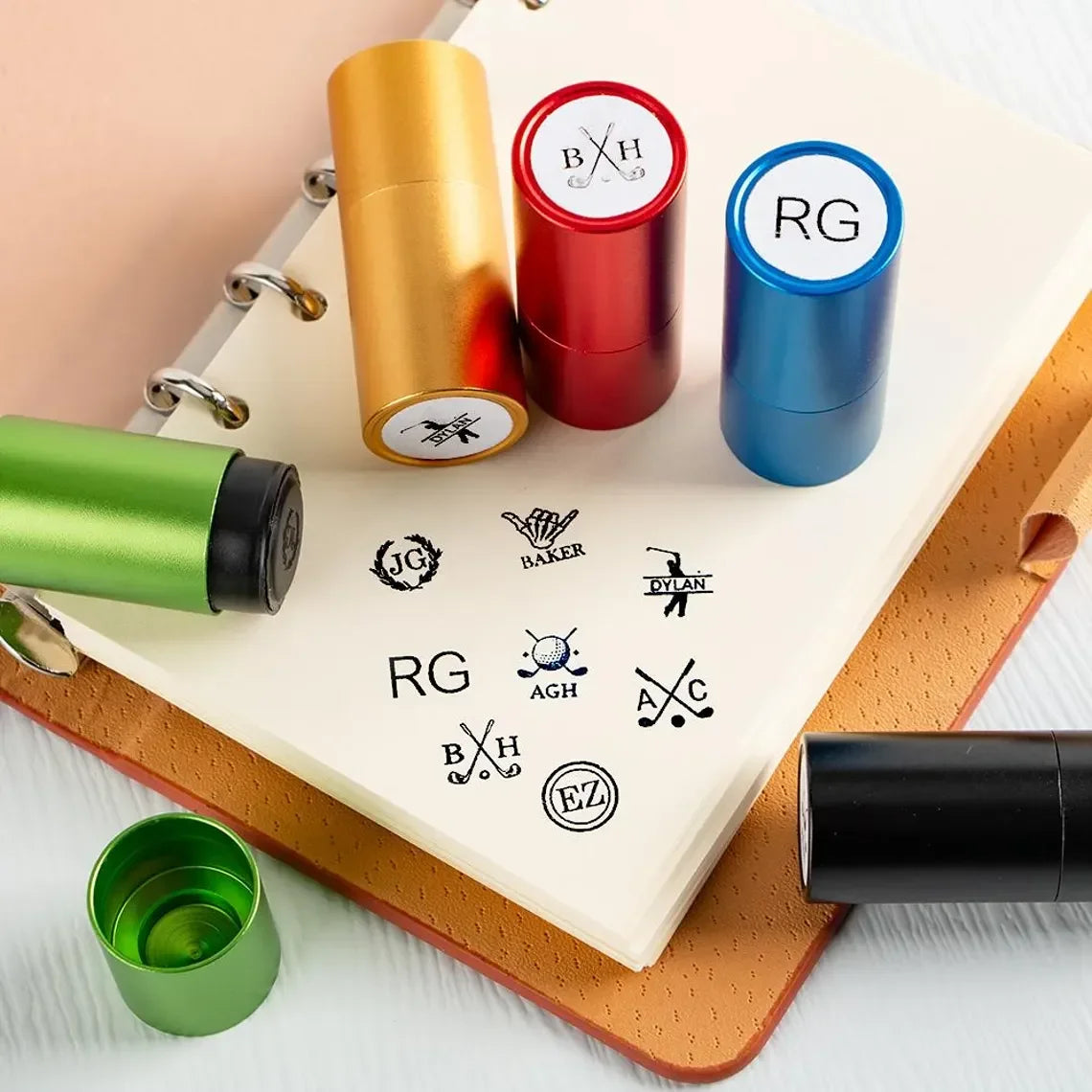 Colorful stamp containers with various stamps on a notebook