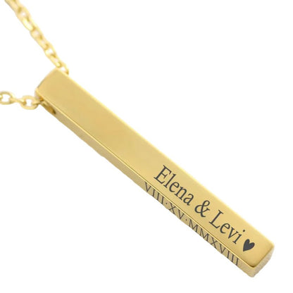 Gold bar necklace with engraved names on a light background