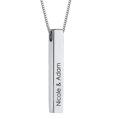 Silver necklace with a vertical bar pendant engraved with 'Nicole & Adam' on a white background.