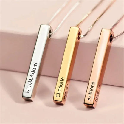 Three vertical bar necklaces with engraved names on a pink background