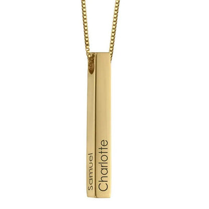 Gold pendant necklace with engraved names on a white background
