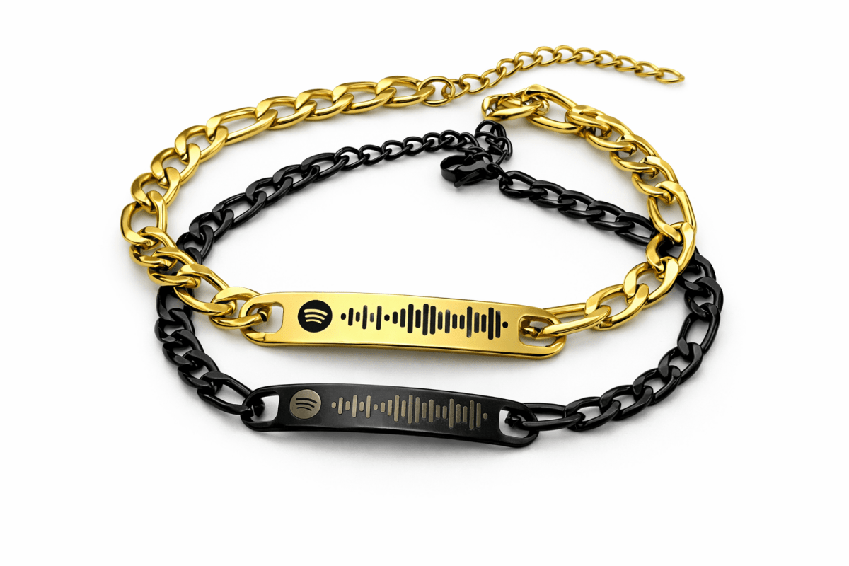 gold and black bracelets engraved with spotify code