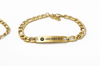 gold bracelet engraved with spotify code